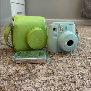 Polaroid Camera, with case, 2 things of film (one already inside never used)